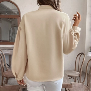 Women's apricot long sleeve blouse with ethnic print and chic lantern sleeves back view