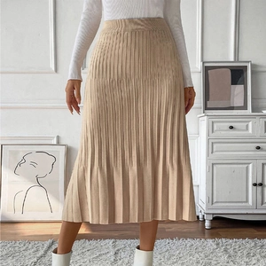Elegant beige pleated knit midi skirt with high elastic waist in an A-line silhouette