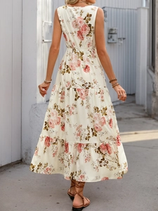 Back view of summer sleeveless maxi dress with pink floral print and tiered cake skirt detail
