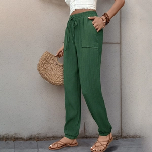 Pantaloni jogger verde scuro in tessuto strutturato con vita elastica e tasca laterale