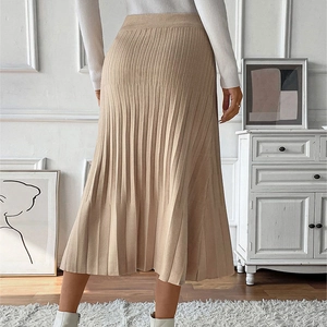 Elegant beige pleated knit midi skirt featuring high waist design and textured rib fabric