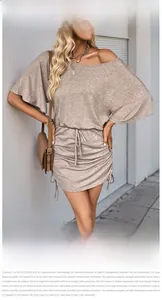 Detail of the drawstring side ruching and ribbed knit texture on the khaki dress