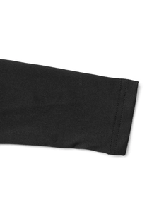 Detailed view of the black knit dress sleeve with durable double-stitched flat seams