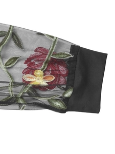 Detail of floral embroidery on black mesh sleeves with ribbed cuffs for bodysuits