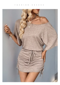 Close-up of off-shoulder knit dress featuring drawstring details and soft ribbed texture