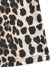 Detail shot of leopard print dress hem showing professional double-needle stitching quality
