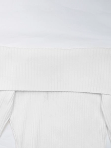 Detailed close-up of the white ribbed knit texture and elegant off-shoulder fold design