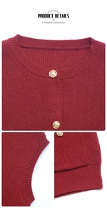 Detail of dark red knit vest featuring embossed gold buttons and ribbed knit edges