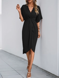 Detail of elegant black V-neck dress featuring a stylish waist knot and tulip hemline