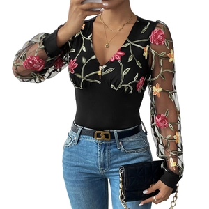 Women's black V-neck bodysuit featuring sheer mesh sleeves with floral embroidery