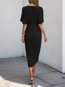 Rear view of a black midi dress featuring short ruffle sleeves and high elastic waist