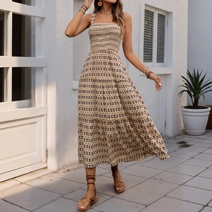 Bohemian geometric print tiered maxi dress with smocked bodice and thin straps
