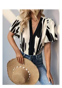 Detail of elegant V-neck chiffon bodysuit with geometric print and short sleeves