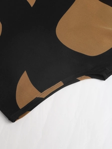 Close-up of the professional stitching and abstract geometric print on the sleeve cuff