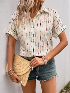 Close-up of the short sleeve shirt showing the colorful vertical stripe print and texture