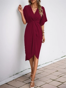 Detail of elegant wine red dress with twist front waist and V-neckline texture