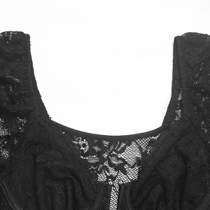 Macro detail of sexy black lace bodysuit featuring floral hollow mesh and a U-neck design