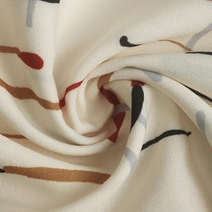 Close-up of contrast print fabric showing soft texture and abstract line patterns