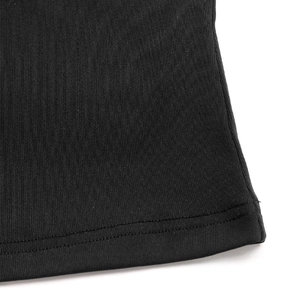 Detail of black ribbed knit fabric showing double-needle hem stitching and fine texture