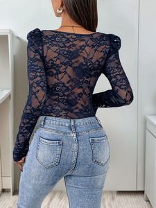 Detail view of lace pattern and see-through mesh on the back of this sexy bodysuit