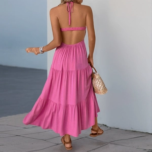Hot pink backless halter tiered maxi dress with cutout detail for summer beach vacation