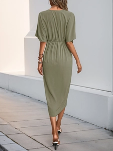Rear view of elegant sage green high-waist dress featuring batwing sleeves and a V-back cut