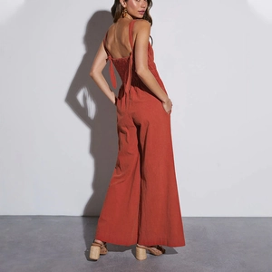 Burnt orange wide-leg jumpsuit with open back and elastic pleated details for women