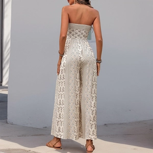 Bohemian smocked strapless jumpsuit with geometric floral print and wide leg silhouette