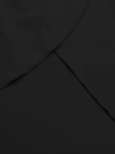 Close-up detail showing professional cross-stitch seams on black fabric of the dress