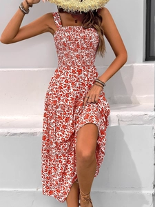Detail of red floral summer maxi dress with smocked bodice and tiered bohemian skirt