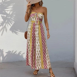 Detail view of ethnic print jumpsuit with tie-knot chest and bohemian geometric pattern