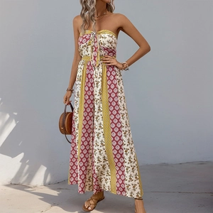 Detail of bohemian tube jumpsuit with mixed ethnic prints and summer vacation vibe
