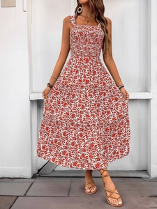 Detail of red floral tiered dress with smocked bodice and square neckline
