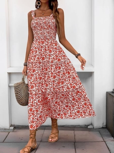 Detailed view of bohemian floral maxi dress featuring tiered skirt and ruched waist