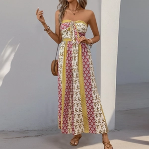 Detail view of bohemian strapless jumpsuit with waist tie and ethnic patchwork patterns