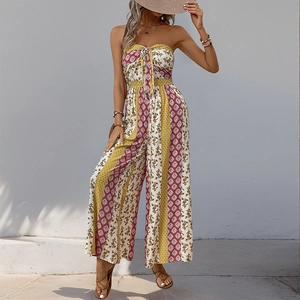 Detail of ethnic print jumpsuit featuring yellow and russet stripes with tie-knot chest