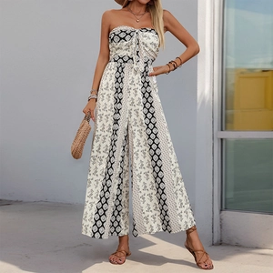Close-up of bohemian geometric print and bow knot detail on strapless wide-leg jumpsuit