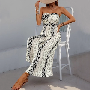 Detail of the bow-tie knot and boho print on this strapless wide-leg summer jumpsuit