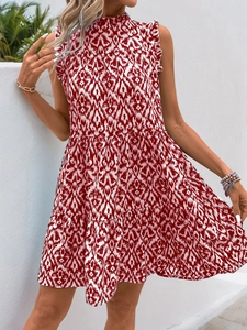 Detail of red and white printed sleeveless dress with ruffled collar and tiered hem