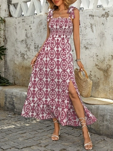 Detail of smocked bodice and tie-shoulder straps on white floral midi dress