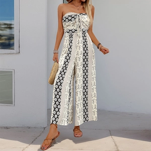 Detail of bohemian strapless jumpsuit with geometric print and front tie knot