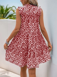Detailed back view of a sleeveless tiered dress with red diamond print and ruffle collar