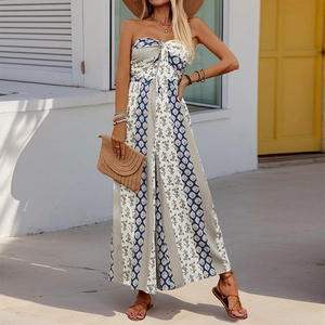 Close-up of bohemian strapless jumpsuit with geometric blue and brown floral patterns