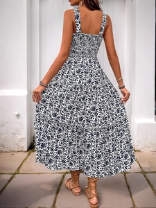 Detail of bohemian floral maxi dress featuring an open back and smocked elastic design