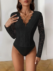Close-up of black lace V-neck detailing and sheer sleeve texture on sexy bodysuit