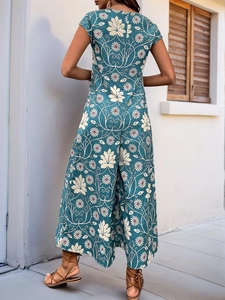 Rear view of floral wide-leg jumpsuit with back V-neck and vintage daisy print