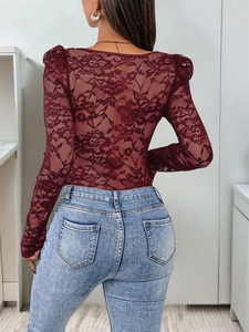 Detailed back view of a burgundy floral lace long-sleeve bodysuit with sheer texture