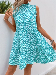 Detailed view of ruffle high neck and turquoise ikat geometric print on sleeveless dress