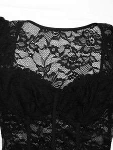 Detail of black floral lace bodysuit showing square neckline and refined stitching