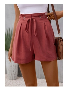 Detail of high waisted casual shorts in terracotta with drawstring and metal eyelets